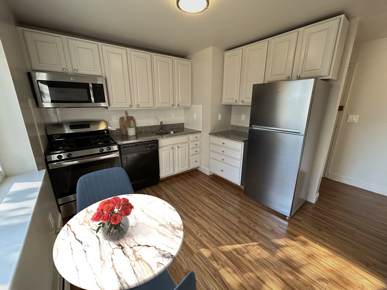 Updated kitchen with granite countertops at Cypress Apartments, Bridgeport CT